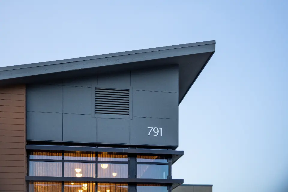 Modern two-story home with its house number on the front