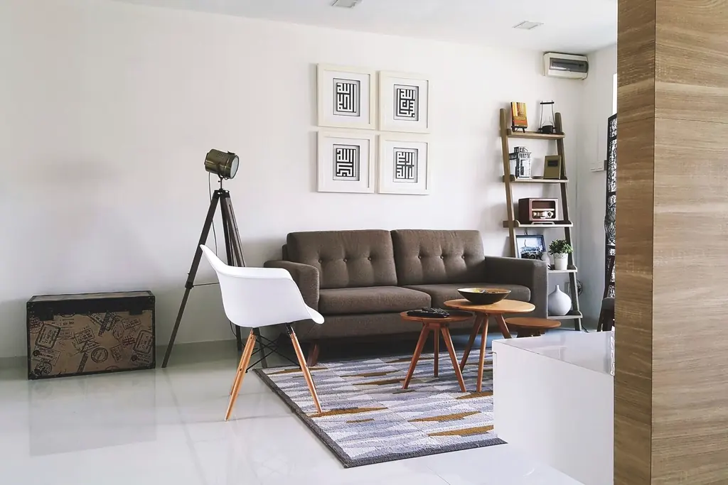 Modern living room with leather sofa and framed prints