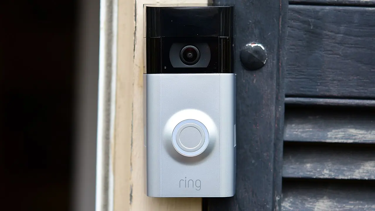 Video doorbell mounted beside a front door